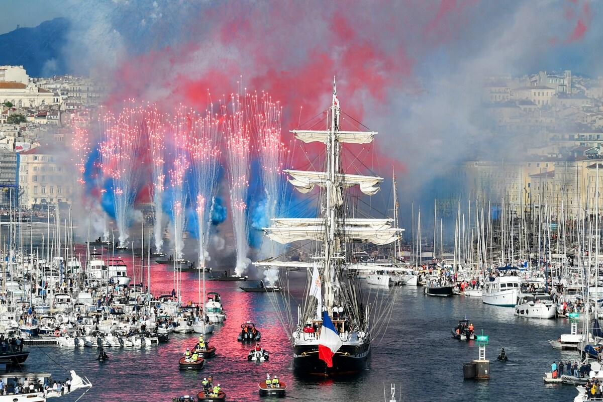 In photos: The Olympic flame arrives in the French port of Marseille